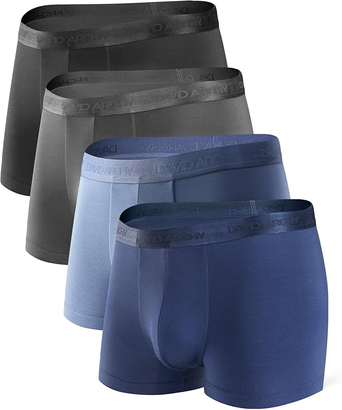 Set of four pairs of men's underwear with various colored waistbands on a white background