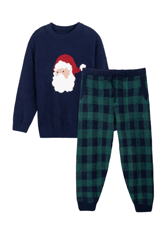 Children's navy sweater with Santa Claus design and green plaid pants on a light gray background